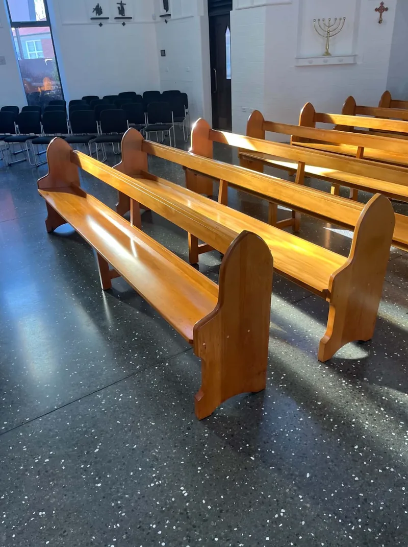 Restored wooden church pews installed in a Christchurch church