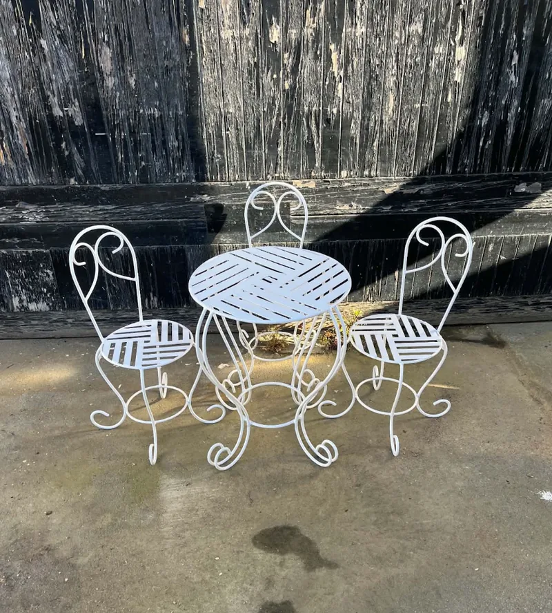 Refurbished white metal garden table and chairs after restoration by D.J. Morrison, Christchurch