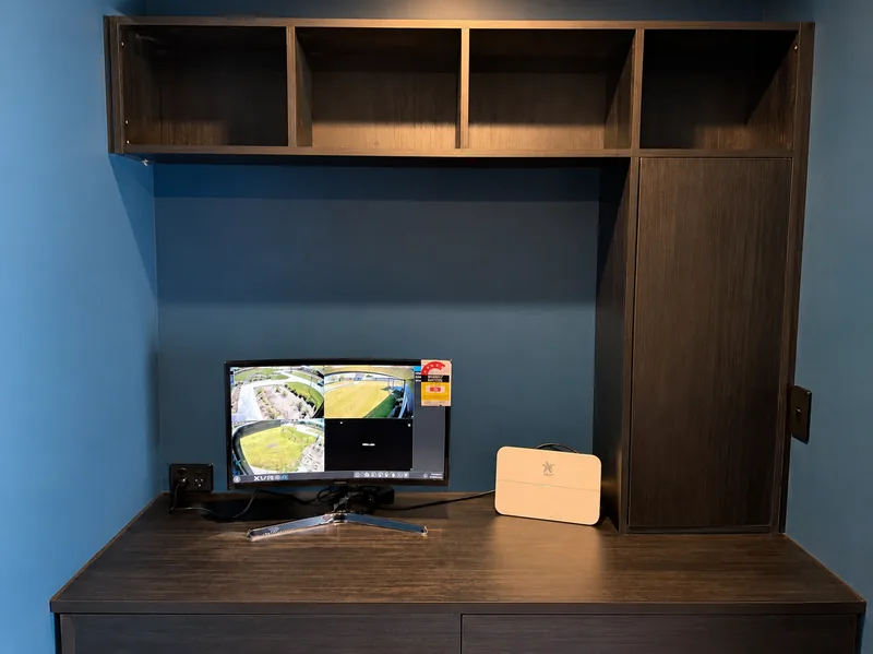Built in office desk and shelving unit in dark stained timber