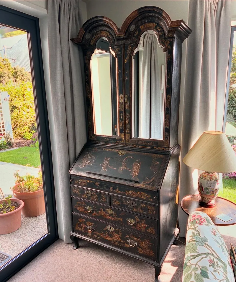 Restored chinoiserie bureau bookcase in black lacquer and gilt with arched mirrored doors