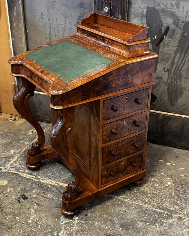 Restored Victorian burr walnut Davenport desk with carved supports and green leather writing surface